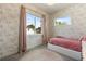 Charming bedroom featuring pink floral wallpaper and two bright windows at 1541 Chestnut Ave, Winter Park, FL 32789