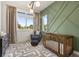 Stylish Bedroom featuring designer accent wall, modern light fixture, and beautiful window light at 1541 Chestnut Ave, Winter Park, FL 32789