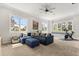 Spacious bonus room featuring a comfortable blue sectional sofa and lots of natural light at 1541 Chestnut Ave, Winter Park, FL 32789