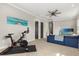 Bonus room with sectional, ceiling fan, and exercise equipment at 1541 Chestnut Ave, Winter Park, FL 32789