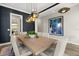Dining room offers modern lighting and a view into other rooms at 1541 Chestnut Ave, Winter Park, FL 32789
