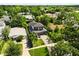 Aerial view of a modern two-story home with a paved driveway and lush landscaping at 1541 Chestnut Ave, Winter Park, FL 32789