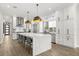 Gourmet kitchen featuring a large island, modern appliances, and sleek white cabinetry at 1541 Chestnut Ave, Winter Park, FL 32789
