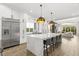 Modern kitchen with large island, stainless steel appliances, and open floor plan at 1541 Chestnut Ave, Winter Park, FL 32789