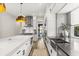 Open concept kitchen featuring an island with white countertops and stainless steel appliances at 1541 Chestnut Ave, Winter Park, FL 32789