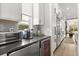 Well-equipped kitchen with stainless steel appliances, wine fridge, and custom cabinetry at 1541 Chestnut Ave, Winter Park, FL 32789