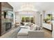 Airy living room with a sleek fireplace, comfortable seating, and seamless access to the outdoor pool area at 1541 Chestnut Ave, Winter Park, FL 32789