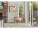 Bright sitting area features modern chair, stylish lighting, and access to the outdoors through glass doors at 1541 Chestnut Ave, Winter Park, FL 32789