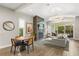 Bright living room features a modern fireplace, open layout, and sliding glass doors to the backyard at 1541 Chestnut Ave, Winter Park, FL 32789