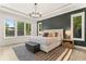 Serene bedroom with a cozy rug, modern light fixture, and view of the backyard at 1541 Chestnut Ave, Winter Park, FL 32789