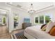 Airy main bedroom with backyard access, natural light, and an en-suite bathroom at 1541 Chestnut Ave, Winter Park, FL 32789
