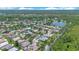 Beautiful aerial view of a lush, green community with homes, lakes, and mature trees at 157 Bell Tower E Xing, Kissimmee, FL 34759