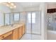 En suite bathroom with glass-enclosed shower and vanity at 157 Bell Tower E Xing, Kissimmee, FL 34759