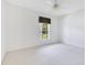 Bright bedroom featuring a ceiling fan and a large window overlooking the yard at 157 Bell Tower E Xing, Kissimmee, FL 34759