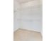 Walk-in closet with built-in wire shelving to maximize storage space at 157 Bell Tower E Xing, Kissimmee, FL 34759
