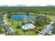 Aerial shot of a well-maintained community pool surrounded by palm trees, lush lawns, and clear, blue water at 157 Bell Tower E Xing, Kissimmee, FL 34759