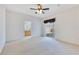 Spacious main bedroom with ceiling fan, sliding glass door, and en suite bathroom access at 157 Bell Tower E Xing, Kissimmee, FL 34759