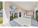 Spacious carport with a blue door, offering covered parking and easy access to the home's entrance at 16602 Citrus Pkwy, Clermont, FL 34714