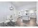 Inviting dining area with glass table, white chairs and kitchen views at 16602 Citrus Pkwy, Clermont, FL 34714