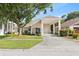 Charming single-story home featuring a covered carport, blue front door, and a well-maintained front yard at 16602 Citrus Pkwy, Clermont, FL 34714