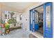 Welcoming front entrance with vibrant blue doors, decorative glass and a cozy seating area at 16602 Citrus Pkwy, Clermont, FL 34714