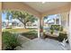 Inviting front porch with seating and potted plants, offering a serene outdoor space at 16602 Citrus Pkwy, Clermont, FL 34714