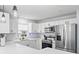 Bright kitchen with stainless steel appliances, white cabinets, and a stylish subway tile backsplash at 16602 Citrus Pkwy, Clermont, FL 34714