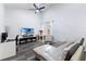 Spacious living room featuring high ceilings, a modern ceiling fan, and wood-look floors at 16602 Citrus Pkwy, Clermont, FL 34714
