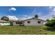 View of the home's exterior from the well-maintained grassy backyard at 1746 Valley Forge Road, Orlando, FL 32806