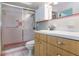 Bathroom featuring a glass shower, wood vanity, and clean white countertop at 1746 Valley Forge Road, Orlando, FL 32806
