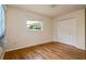 Bedroom featuring hardwood flooring, a double-door closet, and window at 1746 Valley Forge Road, Orlando, FL 32806