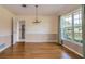 Bright dining room with chandelier, hardwood floors and views to the kitchen at 1746 Valley Forge Road, Orlando, FL 32806