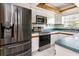 Well-equipped kitchen with stainless steel appliances and white cabinets at 1746 Valley Forge Road, Orlando, FL 32806