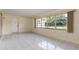Bright and open living room with a large window and tiled flooring at 1746 Valley Forge Road, Orlando, FL 32806