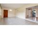 Tiled living room with direct access to the kitchen and an exterior door at 1746 Valley Forge Road, Orlando, FL 32806