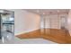 Bright living room with hardwood floors, white walls, and built-in shelving at 1746 Valley Forge Road, Orlando, FL 32806