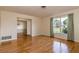 Open concept living room with hardwood floors and natural light from large windows at 1746 Valley Forge Road, Orlando, FL 32806