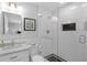 Modern bathroom with a glass-enclosed shower, white subway tile, and marble vanity countertop offers contemporary style at 1850 Geronimo Trl, Maitland, FL 32751