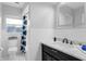 Modern bathroom featuring subway tiles, black vanity with marble countertop, and a shower-tub combination at 1850 Geronimo Trl, Maitland, FL 32751