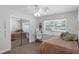 Bedroom features a mirrored closet, adjacent desk area, and comfortable furnishings, creating a peaceful atmosphere at 1850 Geronimo Trl, Maitland, FL 32751