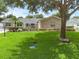 Charming single-story home featuring a brick exterior, manicured lawn, and mature trees at 1850 Geronimo Trl, Maitland, FL 32751