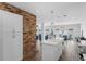 Modern kitchen with white cabinets, an island, and stainless steel appliances at 1850 Geronimo Trl, Maitland, FL 32751