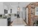Bright and modern kitchen with stainless steel appliances, white cabinetry, and a large island at 1850 Geronimo Trl, Maitland, FL 32751