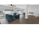 Bright living area featuring large windows, recessed lighting, and neutral decor, with views of the outside garden at 1850 Geronimo Trl, Maitland, FL 32751