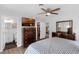 Main bedroom featuring a bathroom, closet, a TV and chest of drawers offering ample storage and convenience at 1850 Geronimo Trl, Maitland, FL 32751