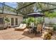 Outdoor patio featuring lounge chairs and dining set at 1850 Geronimo Trl, Maitland, FL 32751
