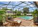 Inviting screened-in pool area with lounge chairs and outdoor dining space, perfect for enjoying sunny days at 1850 Geronimo Trl, Maitland, FL 32751