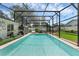 Sparkling screened-in pool features a spacious deck, sun loungers, and lush landscaping for a private outdoor oasis at 1850 Geronimo Trl, Maitland, FL 32751