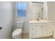 Bathroom with a toilet, a white vanity and a shower-tub combination, and a large mirror at 1877 Courtland Blvd, Deltona, FL 32738