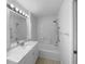 Spotless bathroom featuring a tub and shower combination, offering a space for rejuvenation and relaxation at 1877 Courtland Blvd, Deltona, FL 32738